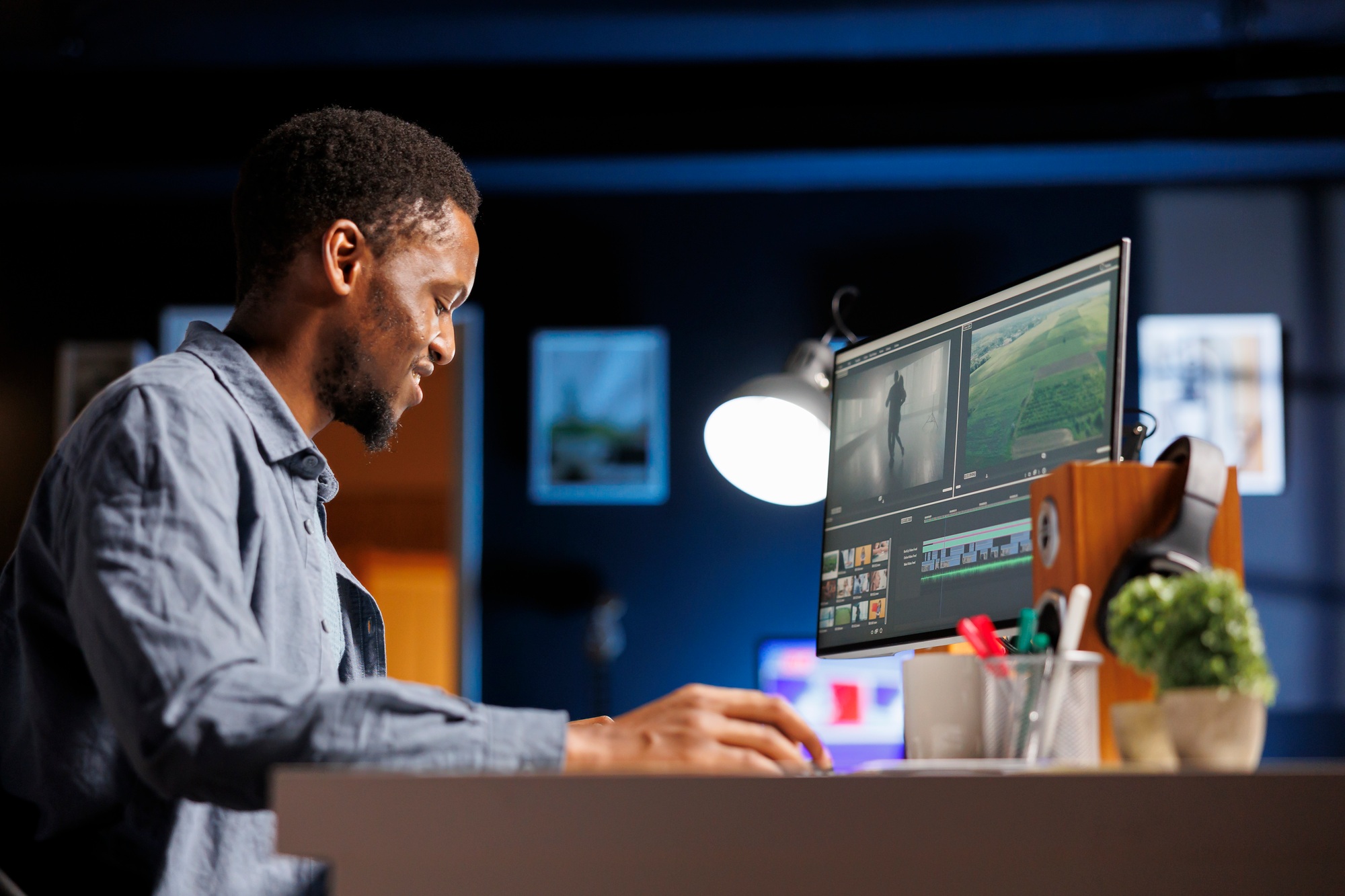 African american videographer works on editing film footage
