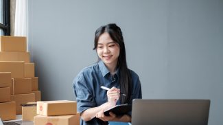 Asian small business owner working at home office. Business retail market and online sell marketing