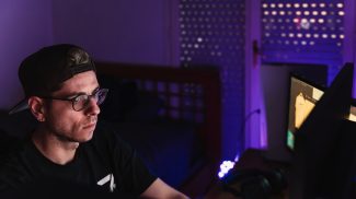 Digital creator working on the computer with his personal brand