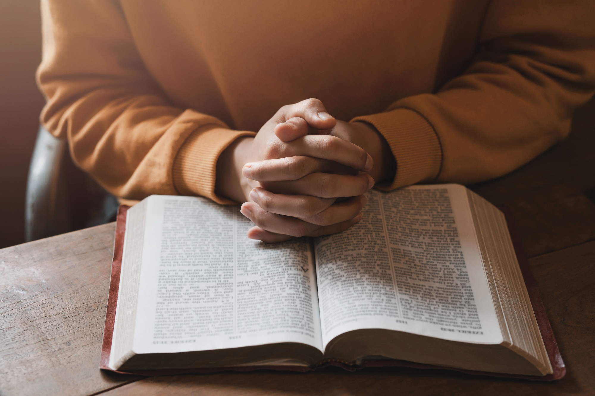 girl praying thanksgiving with holy scriptures God's teachings based on faith and faith