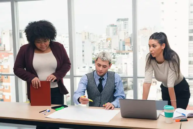 People working in co-working creating strategic business plans and routes