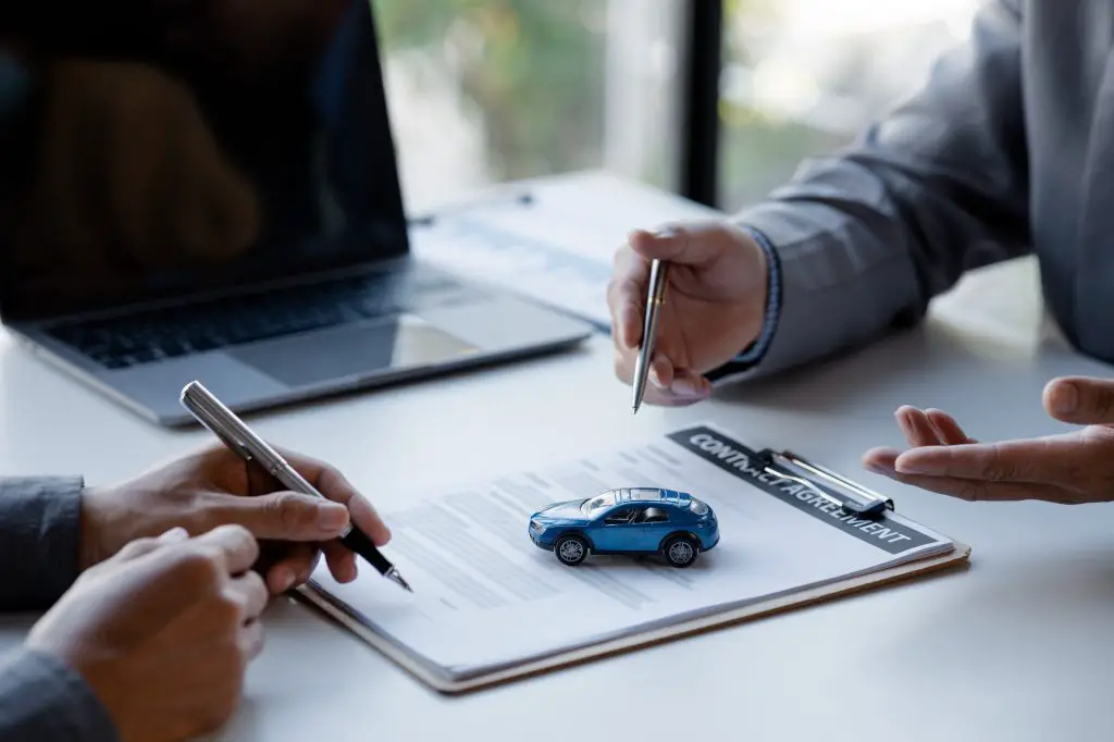 The salesperson is explaining the details of the purchase contract.