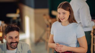 Waitress taking order from customers in restaurant